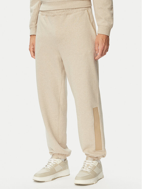 HUGO Spodnie dresowe Dalipant 50563100 Beżowy Relaxed Fit